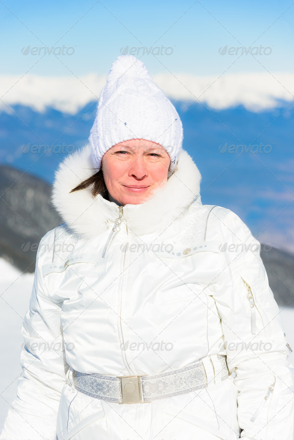 woman in ski suit on a background of mountains (Misc) Photo Download