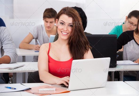 Beautiful University Student With Laptop At Desk (Misc) Photo Download