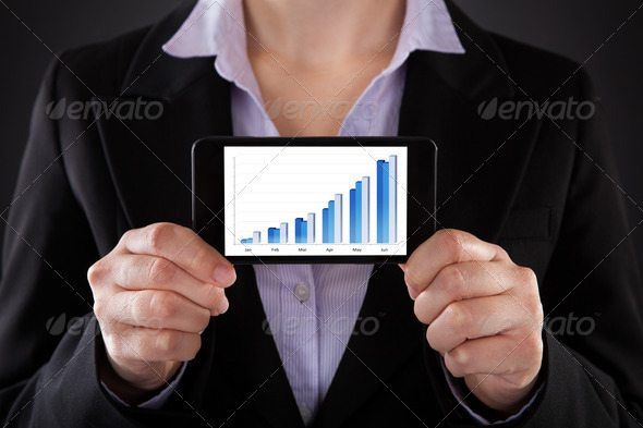 Businessperson Showing Graph On Cellphone (Misc) Photo Download