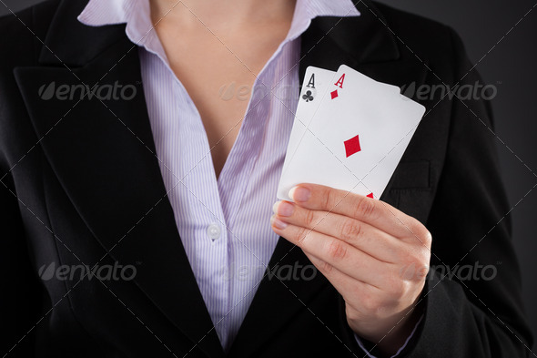 Businessperson Holding Poker Card (Misc) Photo Download