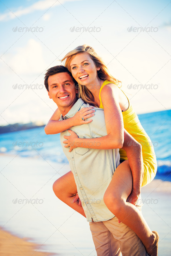 Couple on the beach at sunset (Misc) Photo Download