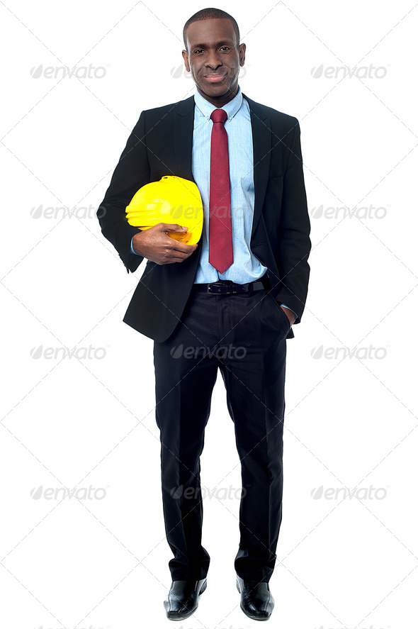 Handsome engineer holding yellow helmet (Misc) Photo Download