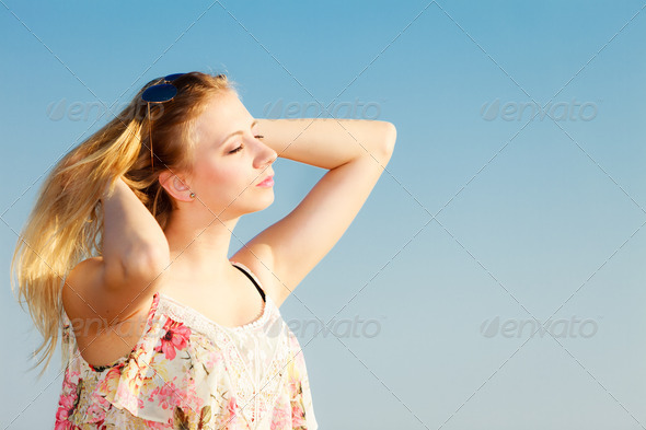 Summer vacation. Girl standing alone on the beach. (Misc) Photo Download