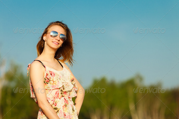 Summer vacation. Girl standing alone on the beach. (Misc) Photo Download