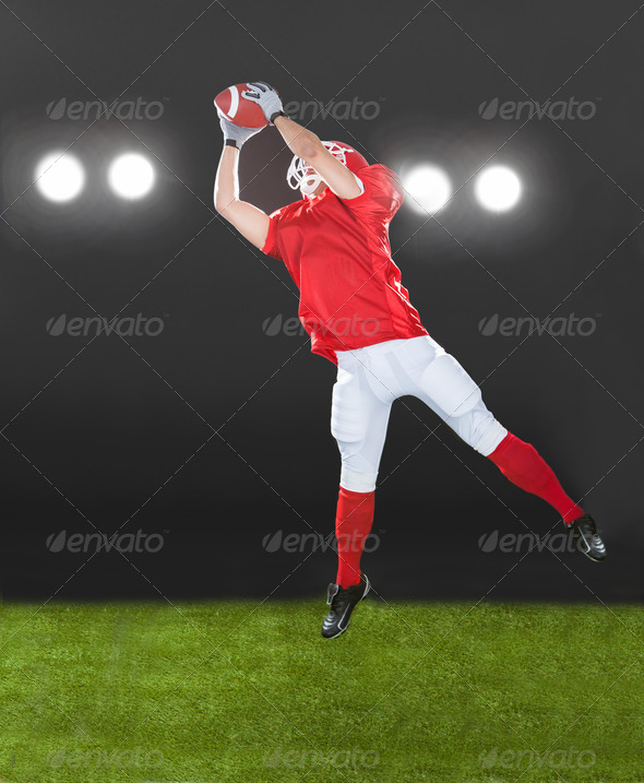 American Football Player Jumping On Field (Misc) Photo Download